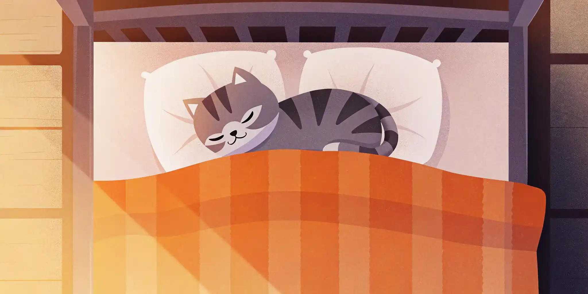 Kitten sleeping soundly in a bed