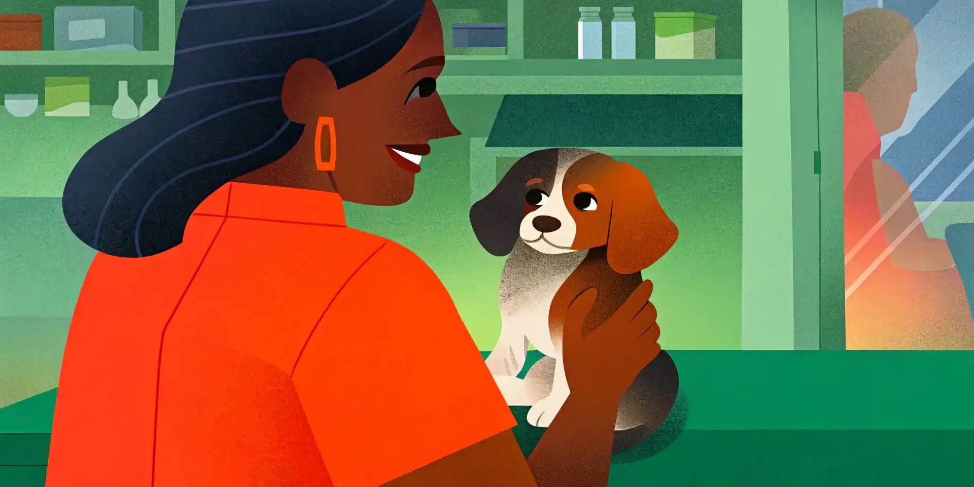 Vet smiling at puppy owner.