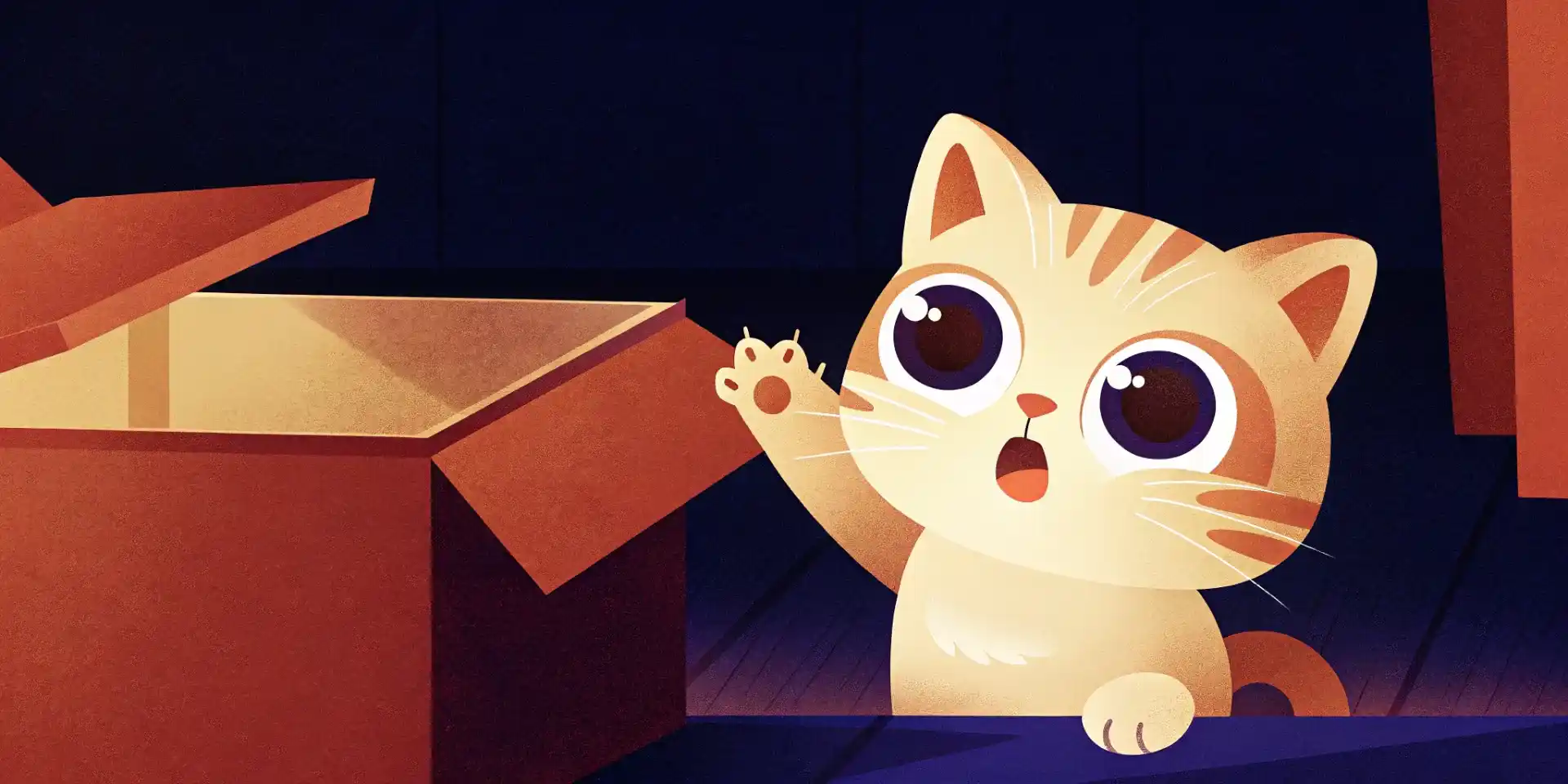 Kitten exploring a cardboard box