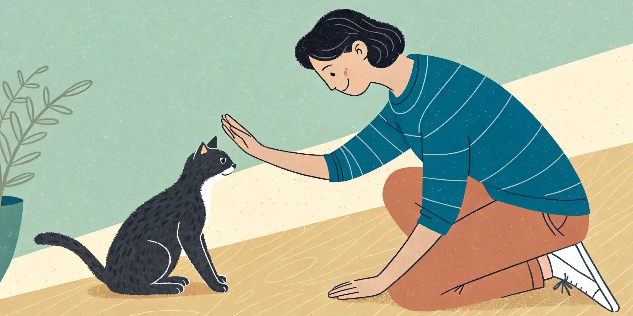 A person petting a cat that is purring and rubbing against their hand.