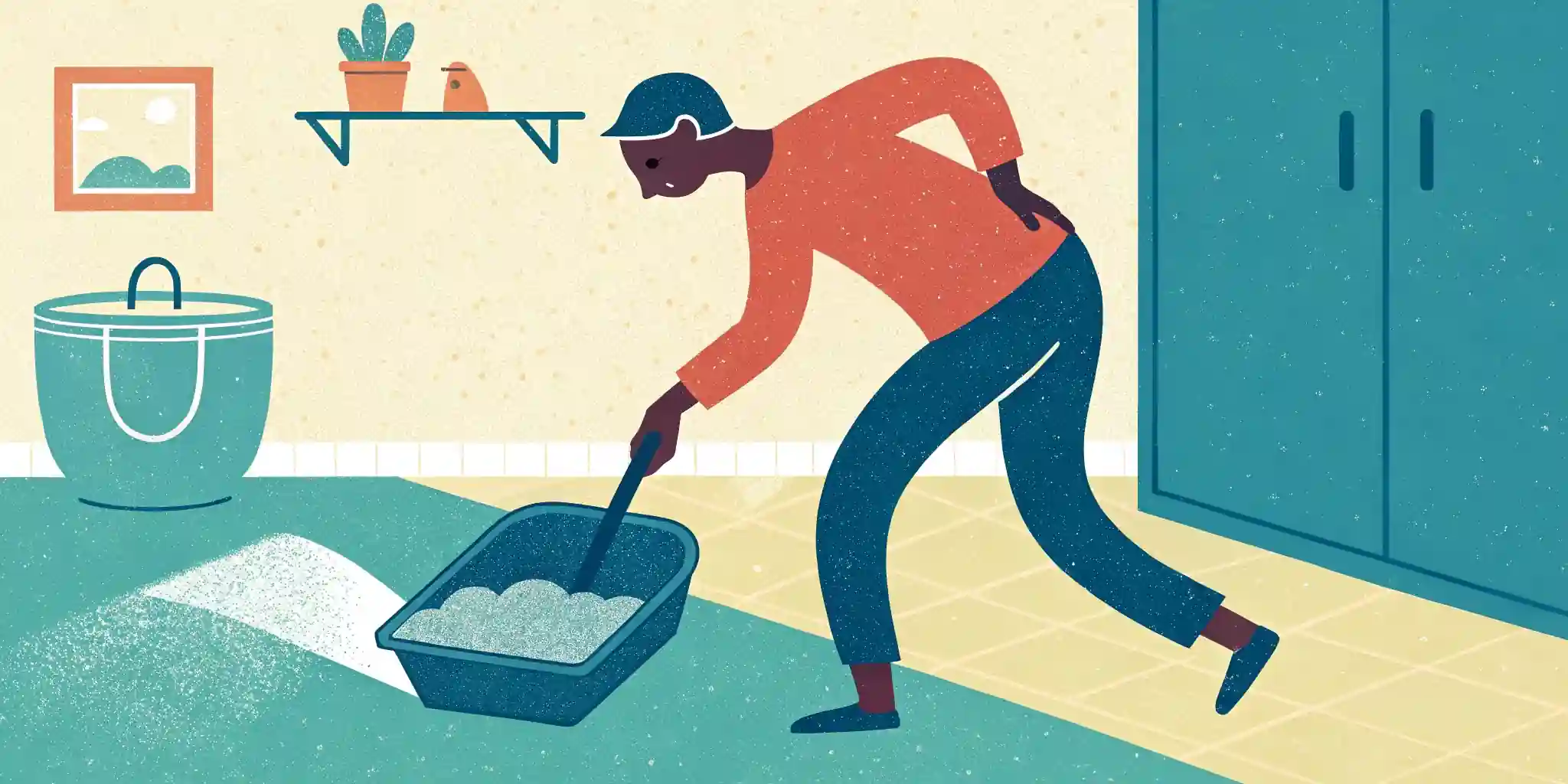 A person scooping a litter box with a scoop